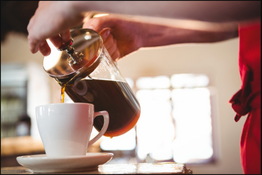 Cafe JEI French Press Pouring Coffee into a cup.