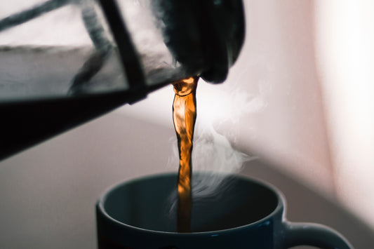 Cafe JEI French Press pouring coffee to a cup.